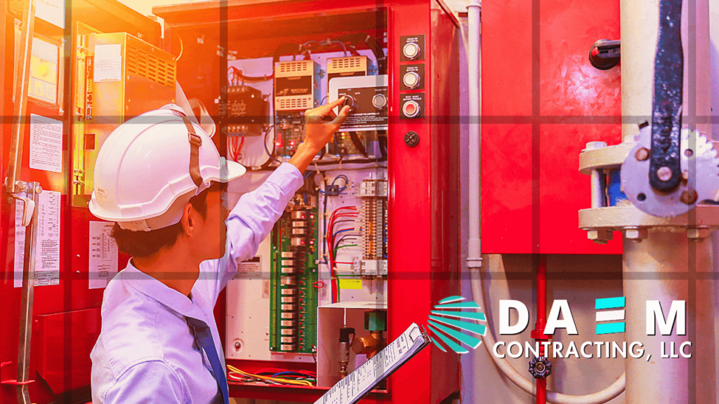 Engineer in hard hat operating a fire control panel, ensuring safety in DAEM CONTRACTING LLC projects
