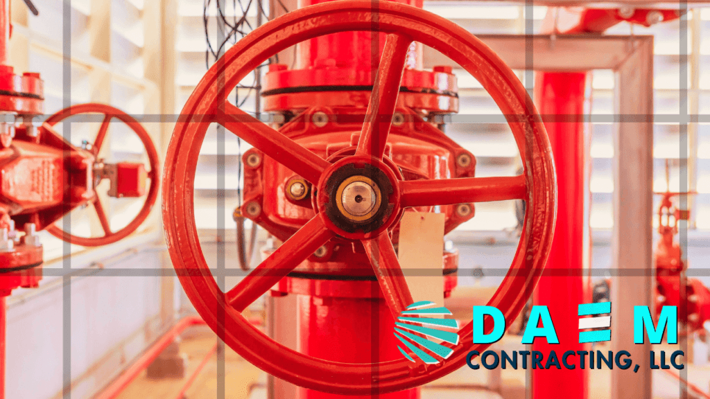 A red valve wheel in a fire suppression system installed by DAEM CONTRACTING LLC
